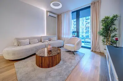 a living room with a couch and a table at Belgrade Waterfront Ana Premium Living in Belgrade