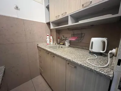 a small kitchen with a sink and a counter at Bridge studio in Belgrade