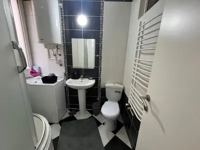 a small bathroom with a toilet and a sink at Bridge studio in Belgrade