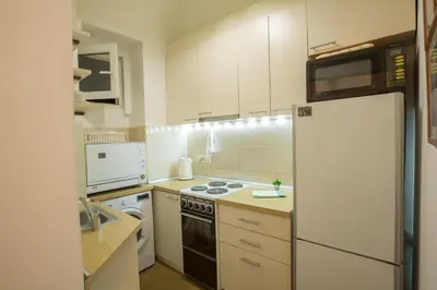 a kitchen with white appliances and a white refrigerator at Apartments Terazije in Belgrade