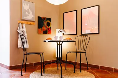 a table and two chairs in a room at Sunwave with Terrace 280 Mbps Old Town Renovated in Belgrade