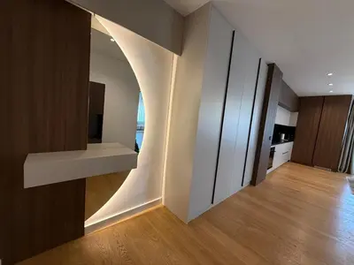 a room with a hallway with a white wall at Landmark Premium Lux Apartment in Želenička Stanica Beograd Sava