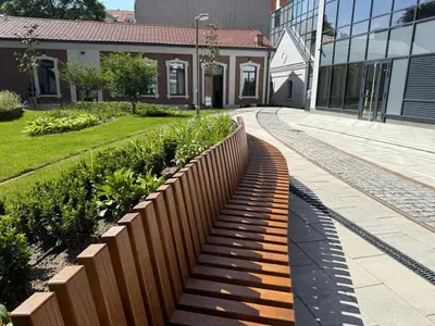 a wooden fence in front of a building at Landmark Premium Lux Apartment in Želenička Stanica Beograd Sava