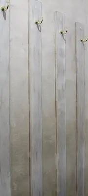 a group of four metal doors on a wall at Apartman 11550 in Lazarevac