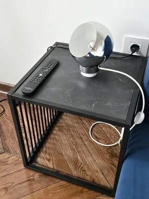 a black coffee table with a remote control on it at High White apartments 2 NEW in Belgrade