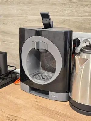 a toaster sitting on a counter next to a coffee maker at High White apartments 2 NEW in Belgrade