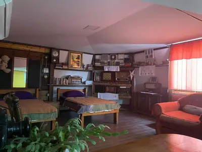 a living room with a bed and a table at Apartment Jancic in Smederevo