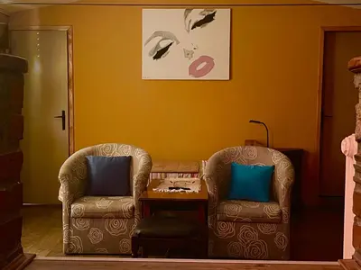 two chairs and a table in a living room at Apartment Jancic in Smederevo