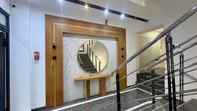 a hallway with a mirror and a stairway at Belgrade Terrace Apartment in Belgrade