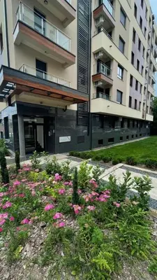 a garden with pink flowers in front of a building at Belgrade Terrace Apartment in Belgrade