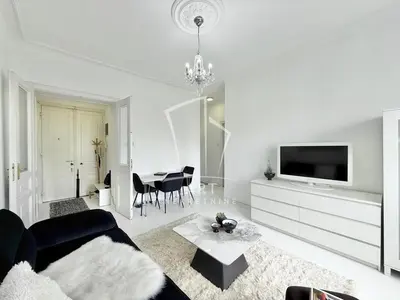a living room with a couch and a tv and a table at Park Oasis Centerpoint Residence in Belgrade