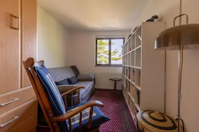 a living room with two chairs and a couch at Kućica na brdu-Zaklopača in Zaklopača