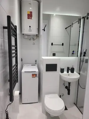 a white bathroom with a toilet and a sink at Don apartment Dorcol in Belgrade