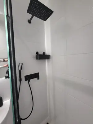 a shower with a shower head in a bathroom at Don apartment Dorcol in Belgrade