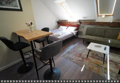 a small living room with a couch and a table at Elidon 1833 in Pančevo