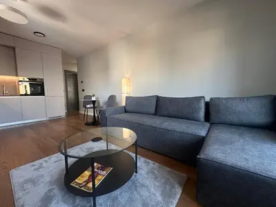 a living room with a couch and a table at Elmora Residence Vračar Južni Bulevar in Belgrade