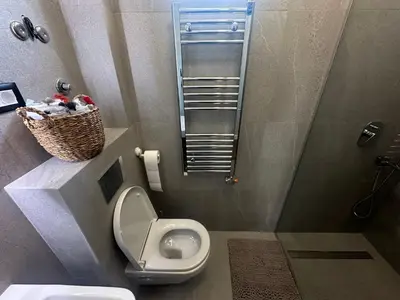 a small bathroom with a toilet and a sink at Elmora Residence Vračar Južni Bulevar in Belgrade