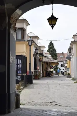 an empty street in a town with a street light at Elan Apartment in Belgrade