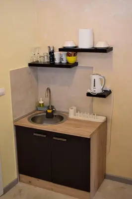 a kitchen with a sink and a counter top at Elan Apartment in Belgrade