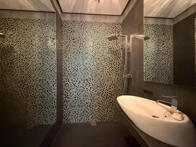 a bathroom with a sink and a shower at City Center Apartment in Belgrade