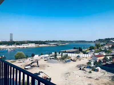 a view of a construction site next to a river at Belgrade Waterfront Kalemegdan and River View with Garage in Belgrade