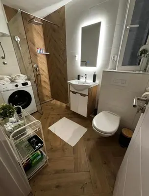 a small bathroom with a toilet and a sink at Sweet home in Belgrade