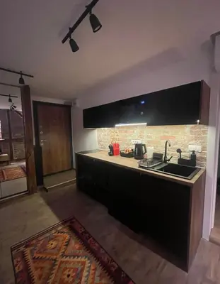 a kitchen with a sink and a counter top at Sweet home in Belgrade