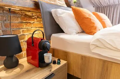 a bedroom with a bed and a red suitcase at Sweet home in Belgrade