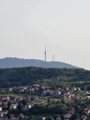 a town on a hill with a tower in the background at Apartman Emi in Belgrade