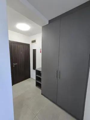 an empty room with a closet and a door at Apartman Emi in Belgrade
