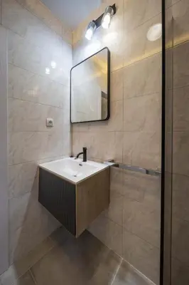 a bathroom with a sink and a mirror at Anja D Apartments in Belgrade