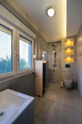 a bathroom with a tub and a toilet and a sink at Anja D Apartments in Belgrade