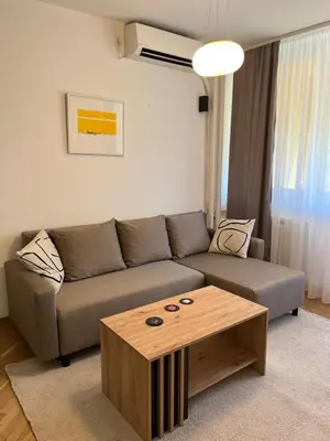a living room with a couch and a coffee table at Orientale in Belgrade