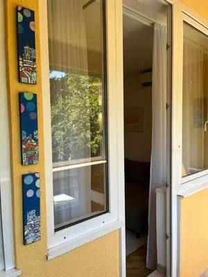 a window on the side of a house at Orientale in Belgrade