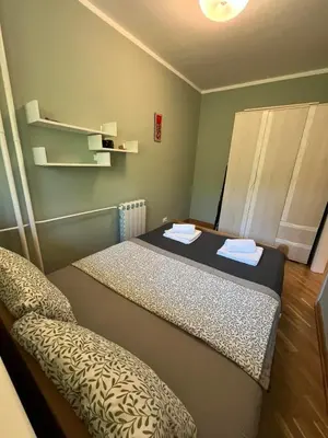 a room with a bed and a chair in it at Orientale in Belgrade