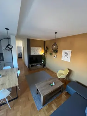 an overhead view of a living room with a couch and a table at Mikos apartmani in Belgrade