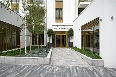 a rendering of the entrance to an office building at Belgrade Waterfront LINA Apartments in Belgrade