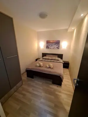 a bedroom with a bed with two pillows on it at Fantastic Belgrade Nights II in Belgrade