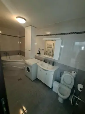 a bathroom with a toilet and a sink and a tub at Fantastic Belgrade Nights II in Belgrade