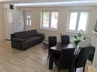 a living room with a couch and a table at Fantastic Belgrade Nights II in Belgrade