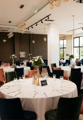 a dining room with white tables and chairs at Vila Aleksandar in Orašac