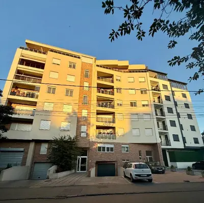 a building with a car parked in front of it at Amar1 in Belgrade