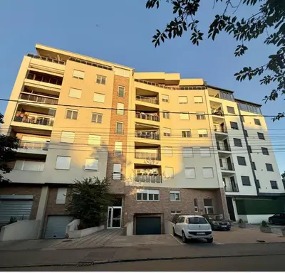 a building with a car parked in front of it at Amar1 in Belgrade