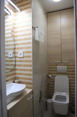 a bathroom with a toilet and a sink at Point Apartman in Belgrade