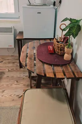 a wooden table with a basket of plants on it at Studio Kalemegdan in Belgrade