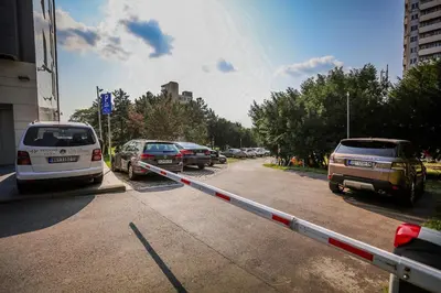 a street with cars parked in a parking lot at Hotel Heritage in Belgrade