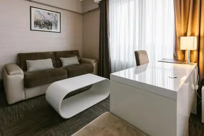 a living room with a couch and a table at Hotel Heritage in Belgrade