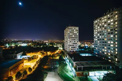 a night view of a city with tall buildings at Hotel Heritage in Belgrade