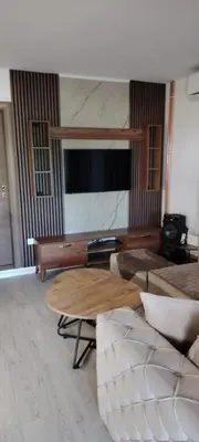 a living room with a couch and a table at Vila Terasa in Čortanovci