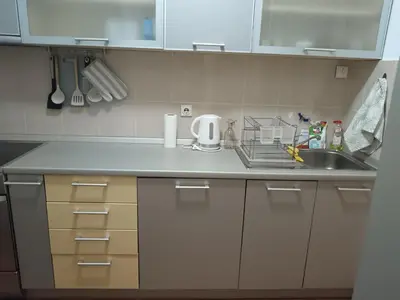 a kitchen with a sink and a counter top at Linda Apartments- Arena in Novi Beograd